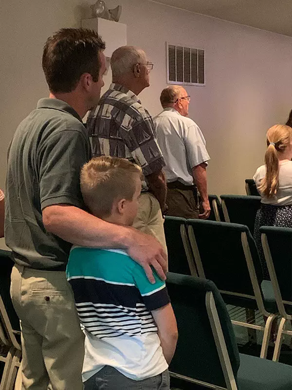 Father and son worship together